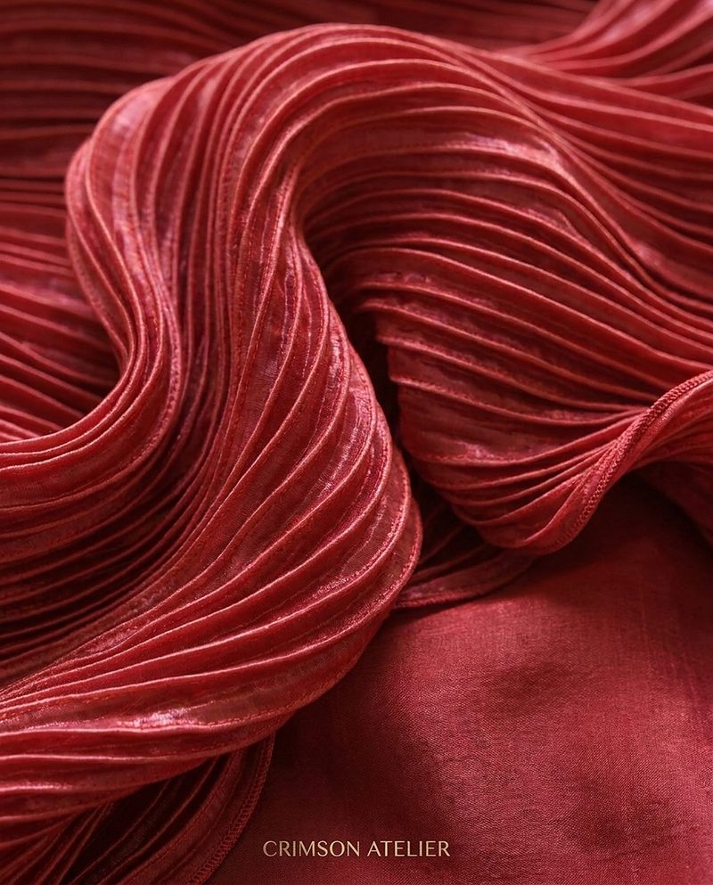 Close-up of pleated crimson velvet fabric